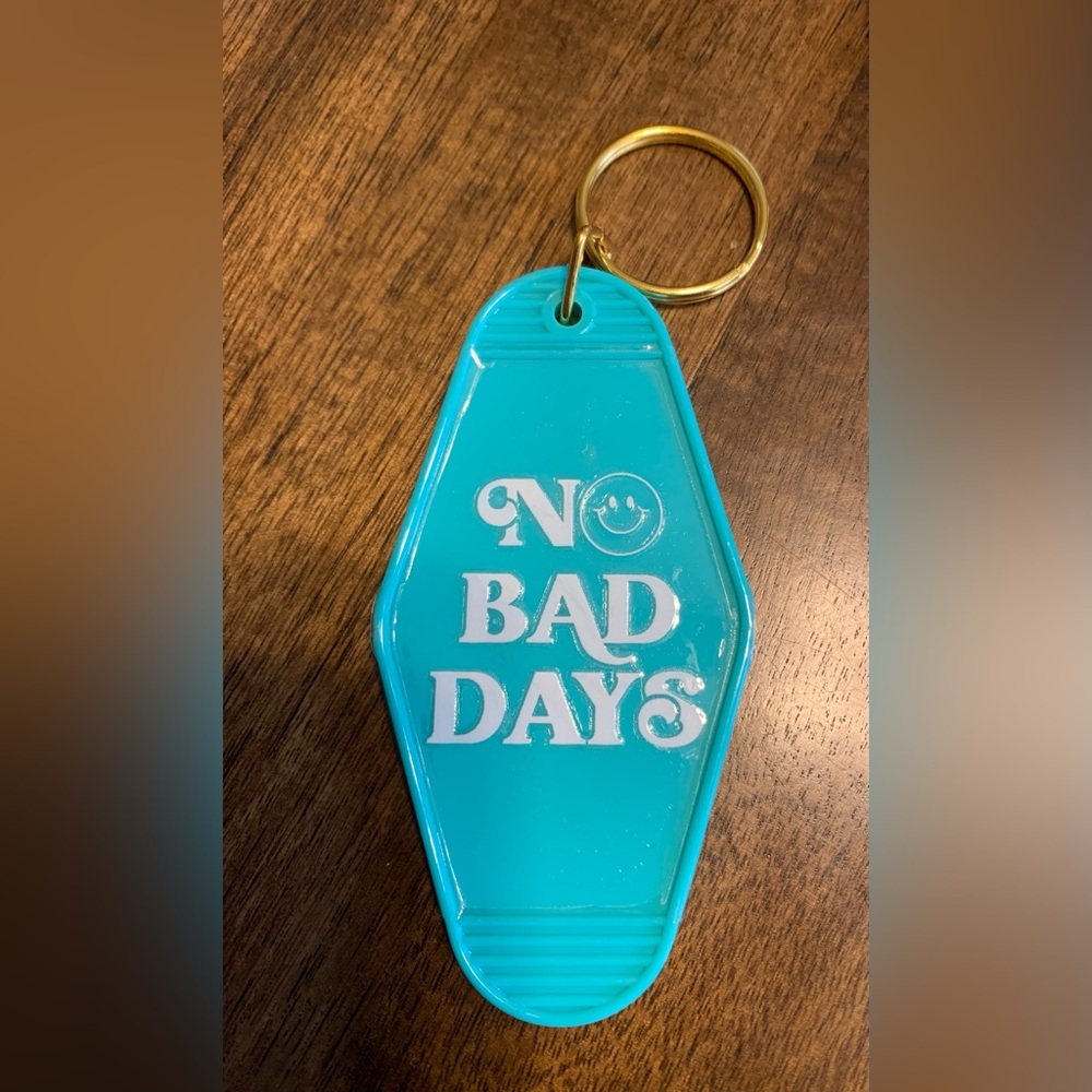 Plastic Keychain
Color - Teal and White Lettering